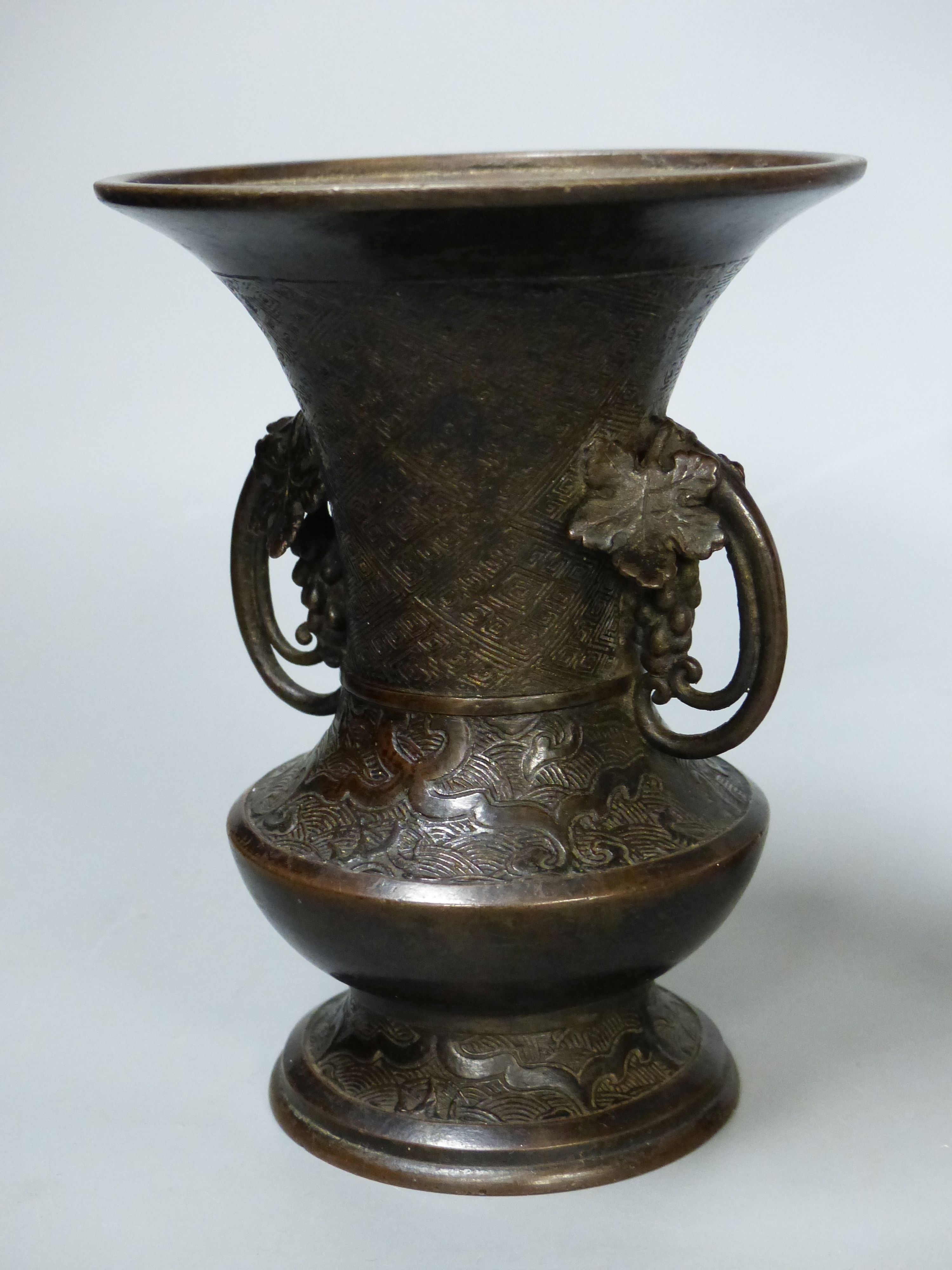 A Chinese underglaze copper red vase, an archaistic bronze vase and a hardstone brushwasher, tallest 25cm